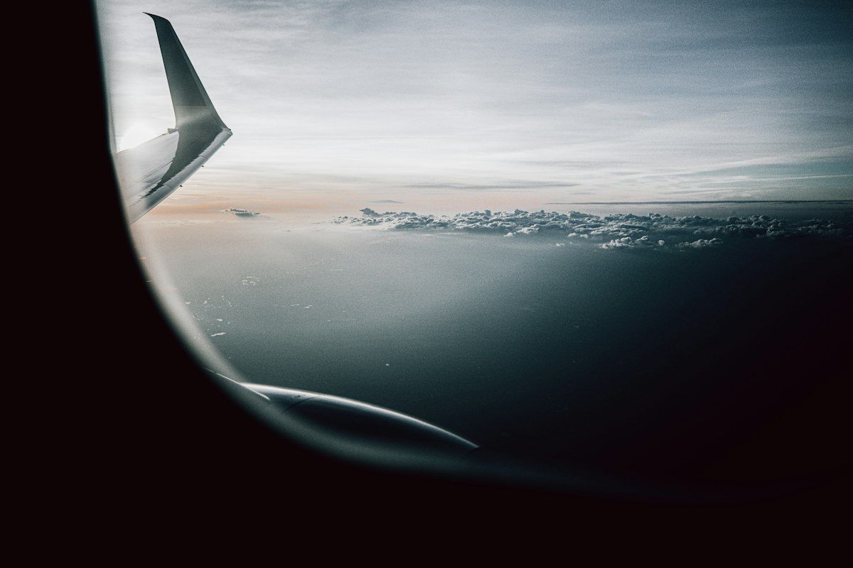 Clouds seen through an airplane window in flight